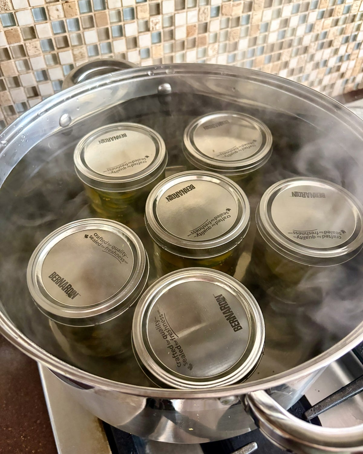 photo if Sweet Yum Yum Pickles in a water bath.