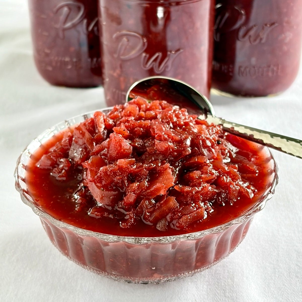 Easy Beet Relish close up photo served in a clear glass vintage bowl.