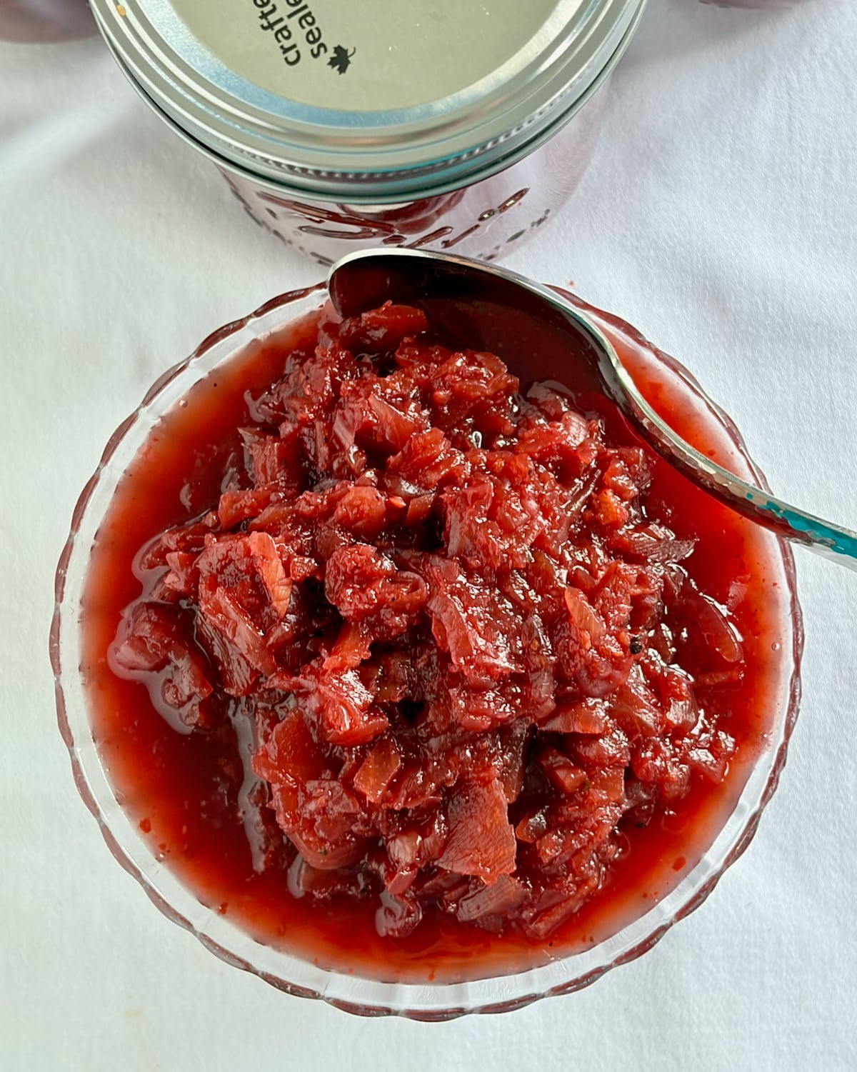 Rectangular shot overhead shot of Easy Beet Relish in a clear glass bowl for social media posts.