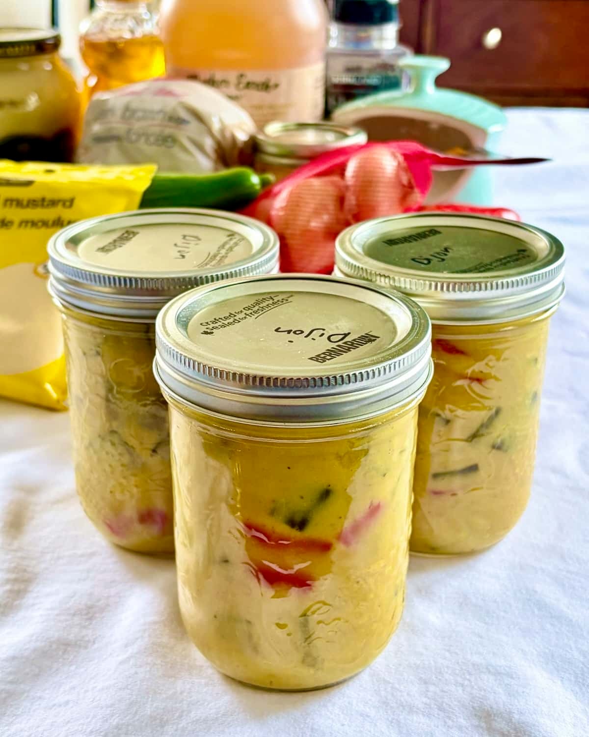 Photo of 3 bottles of Honey Dijon Mustard Pickles.