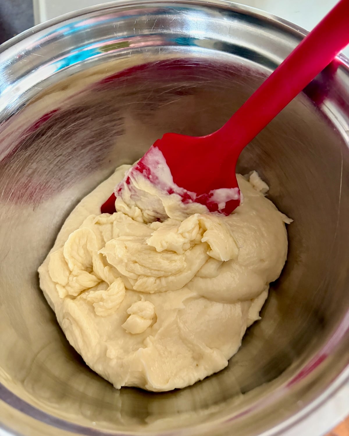 Photo of roux transferred to small metal bowl.