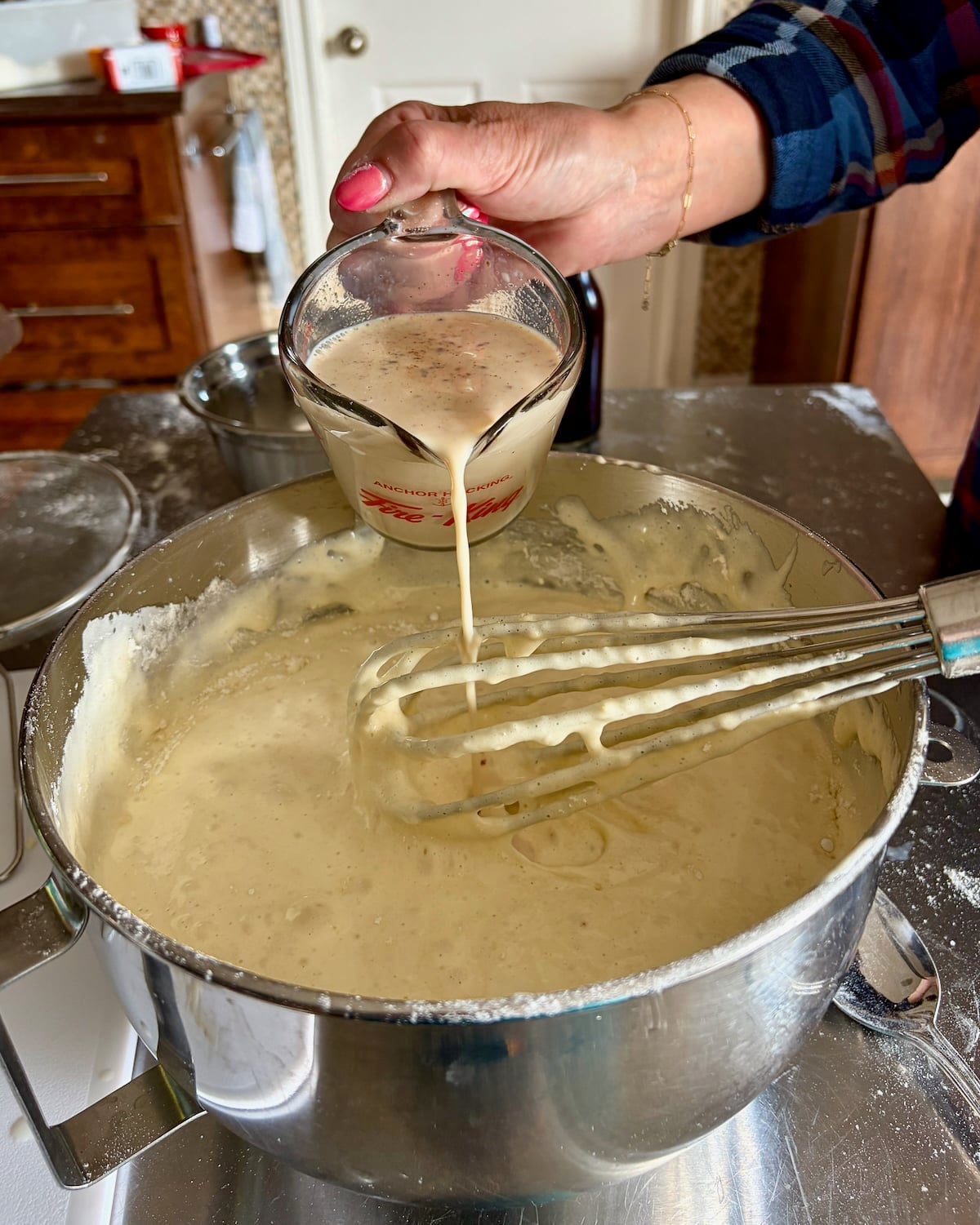 Photo of the milk and vanilla mixture being added to the batter.
