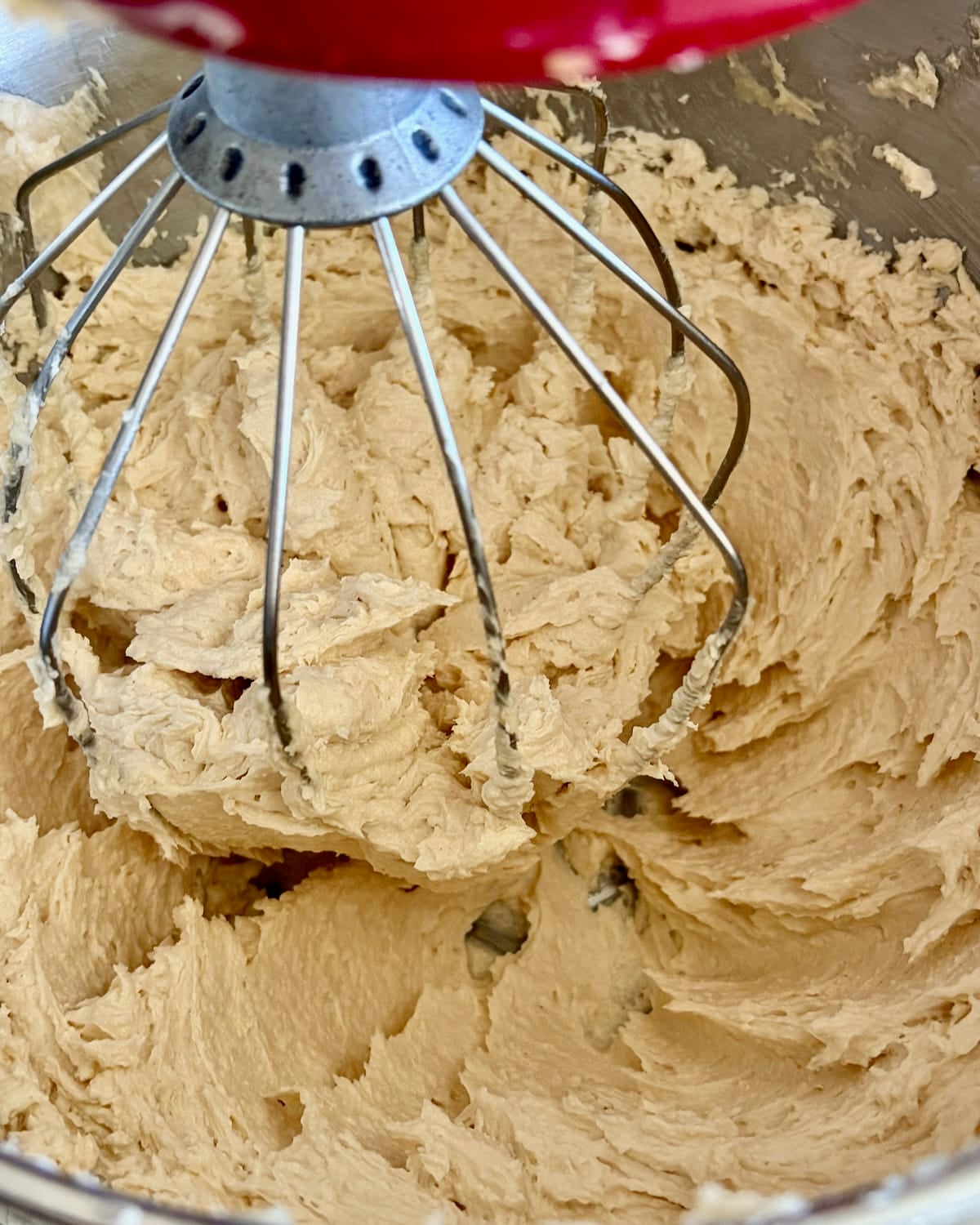 Photo of Ermine Cream frosting being whisked after adding some of the roux.