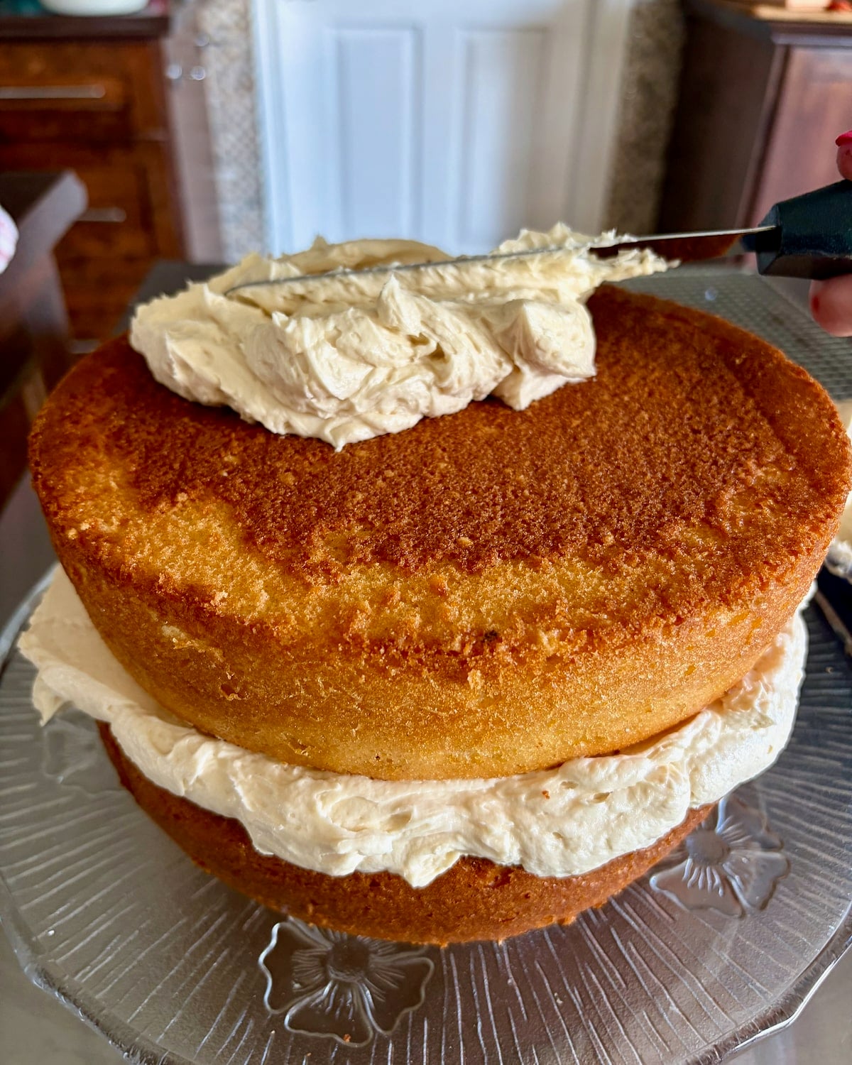 Cake being frosted.