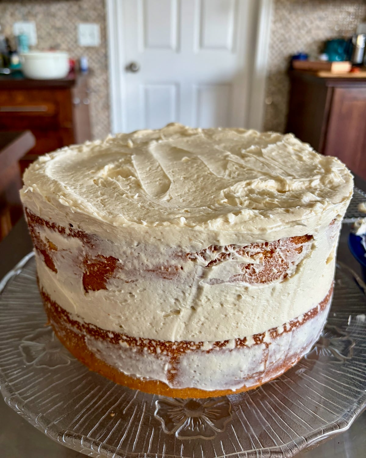 Photo of cake with a crumb coat completed.