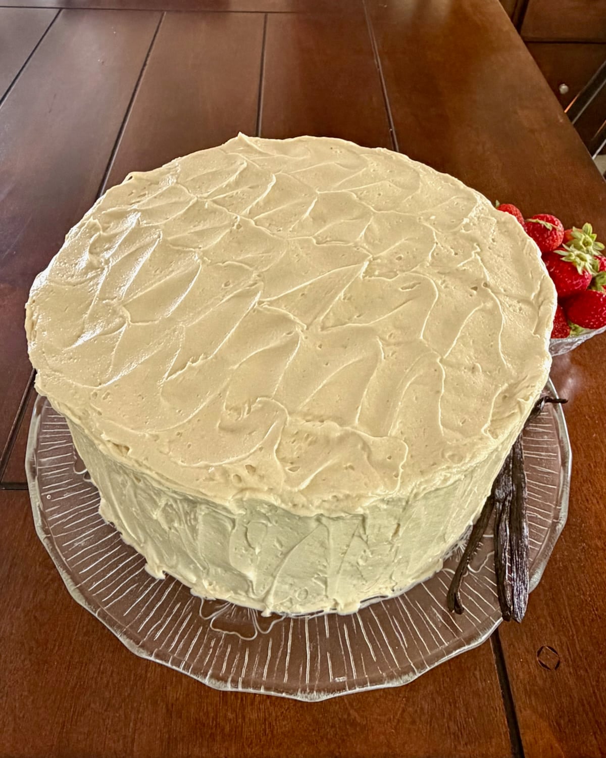 Overhead shot of a complete frosted cake.