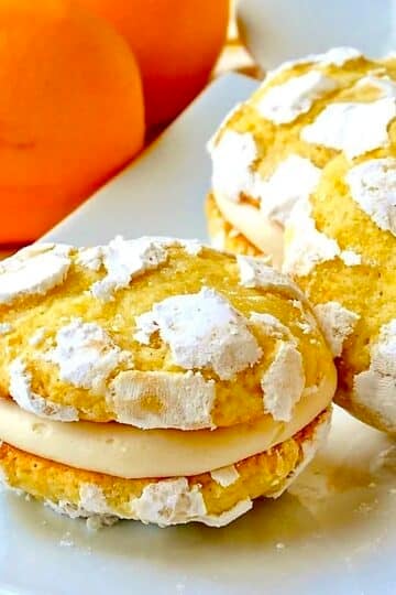 Lemon Cream Cheese Crackle Cookies  cloae up featured image shown on white plate