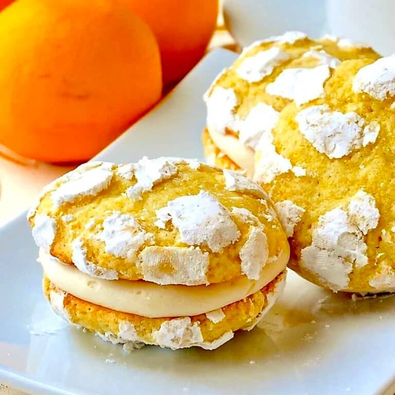 Lemon Cream Cheese Crackle Cookies  cloae up featured image shown on white plate