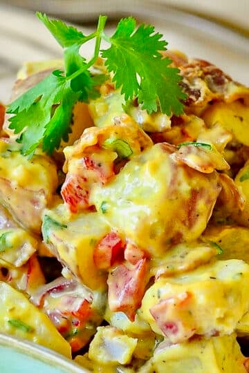 Bacon Potato Salad with Sweet Mustard Dressing in a cream coloured serving bowl