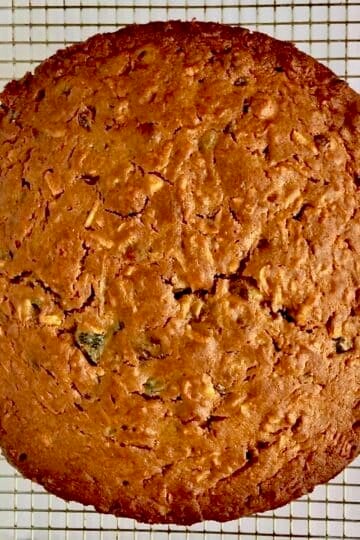 Bourbon Apple Fruitcake Just out of the oven cooling io a rack.