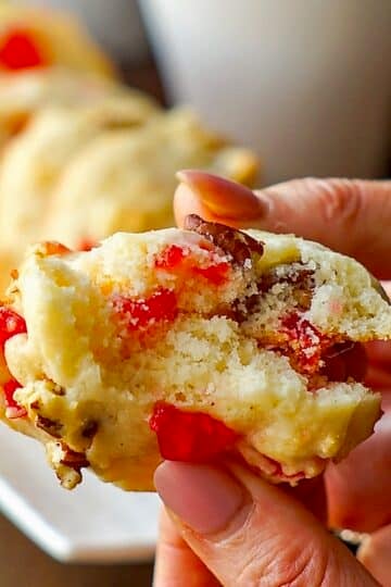 Cookie being broken open to show inside of these soft Cream Cheese Cookies