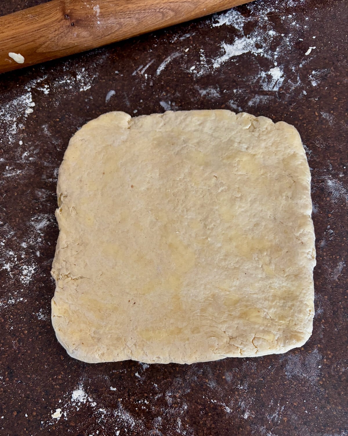Photo of Flaky Sour Cream Biscuits dough rolled into a square.