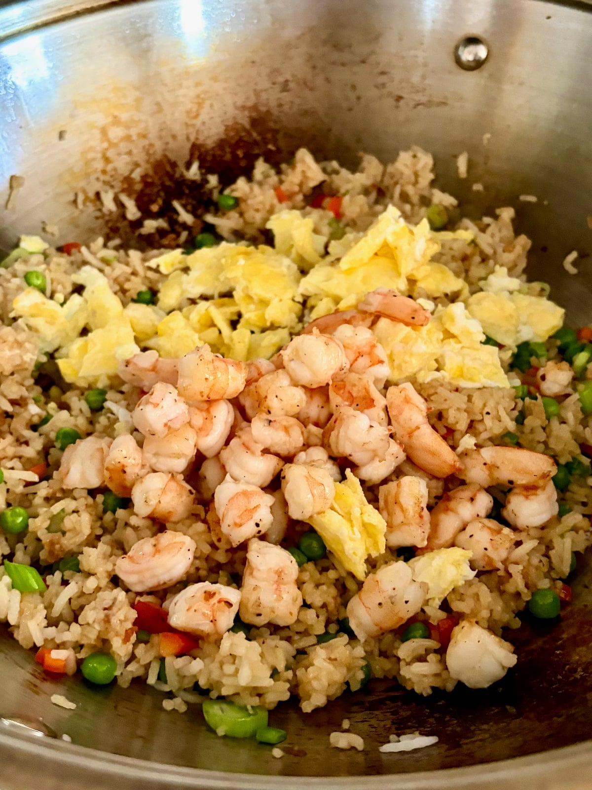 Photo of adding the egg and shrimp back to the wok