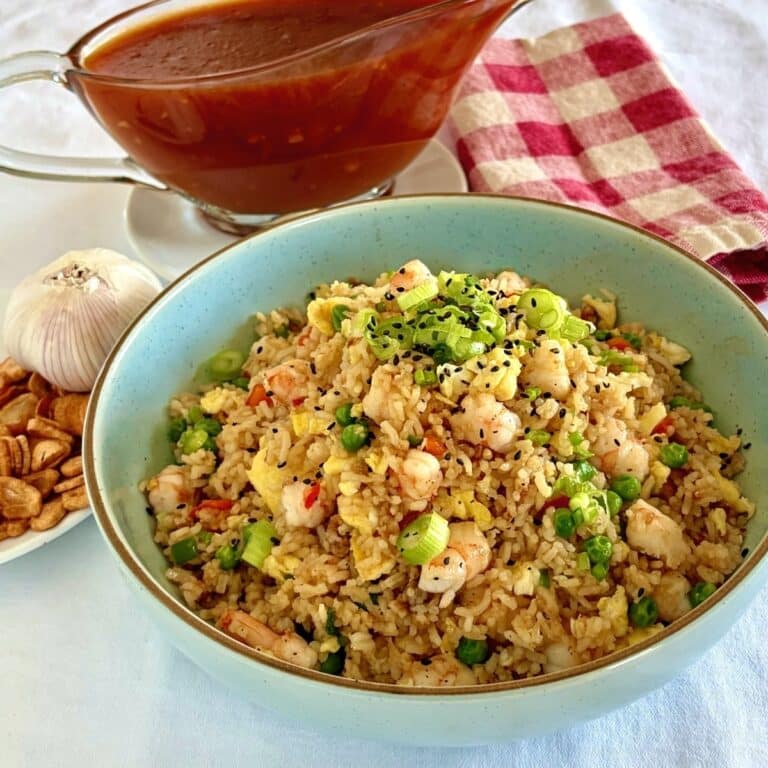 Shrimp fried rice in a blue serving bowl.