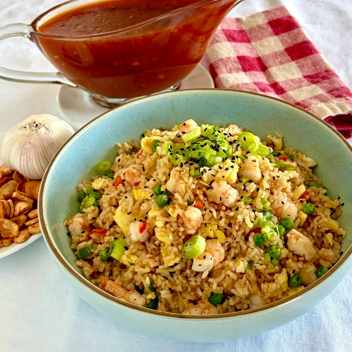 Shrimp fried rice in a blue serving bowl.
