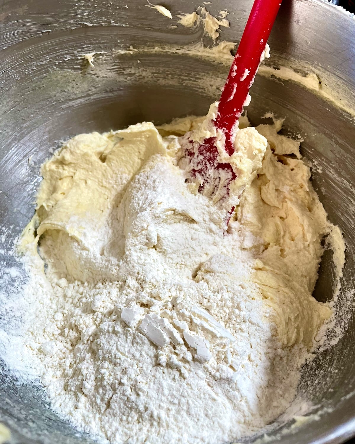 Photo of folding the dry ingredients through the batter.