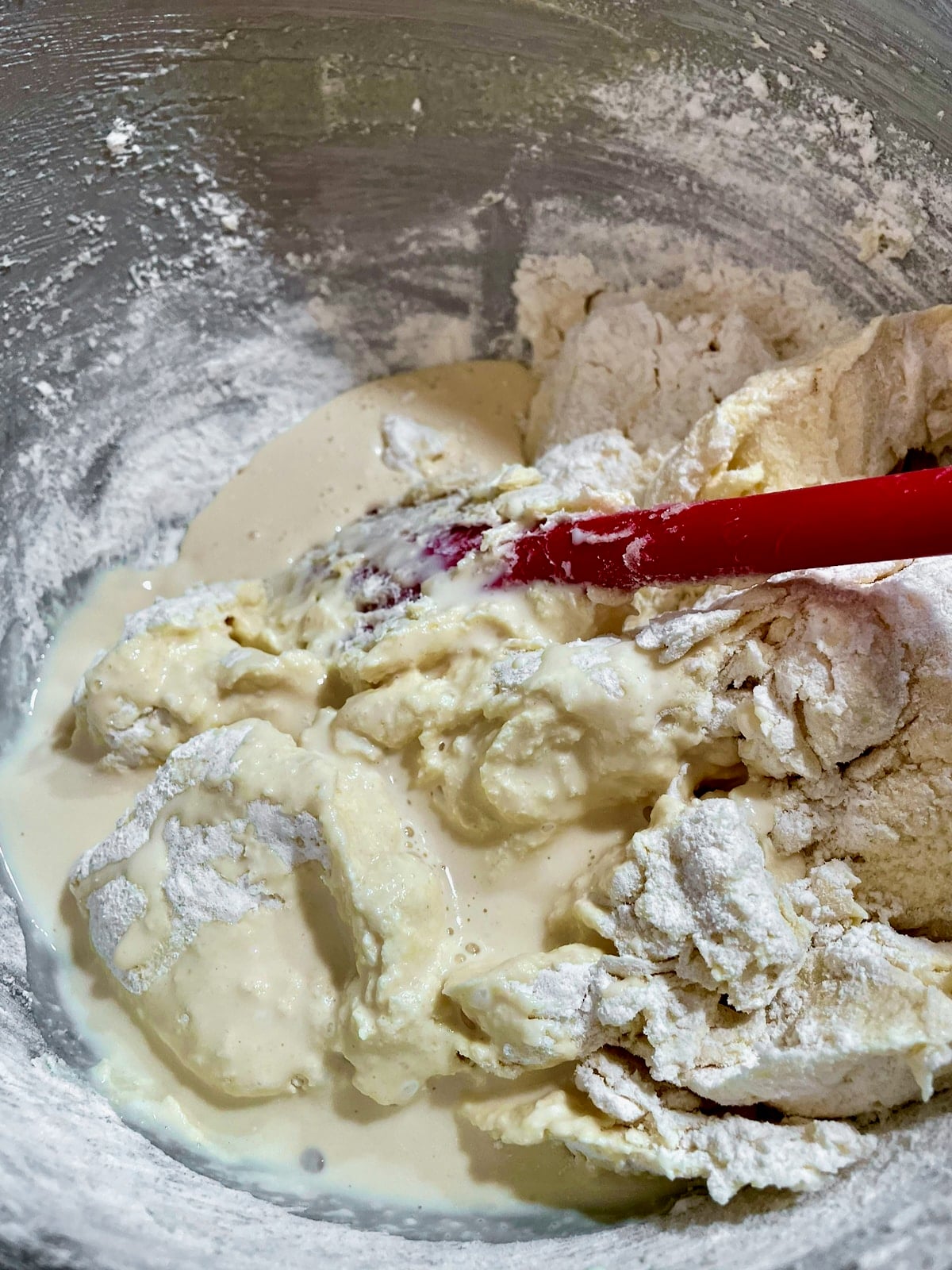 Photo of folding milk through the batter.