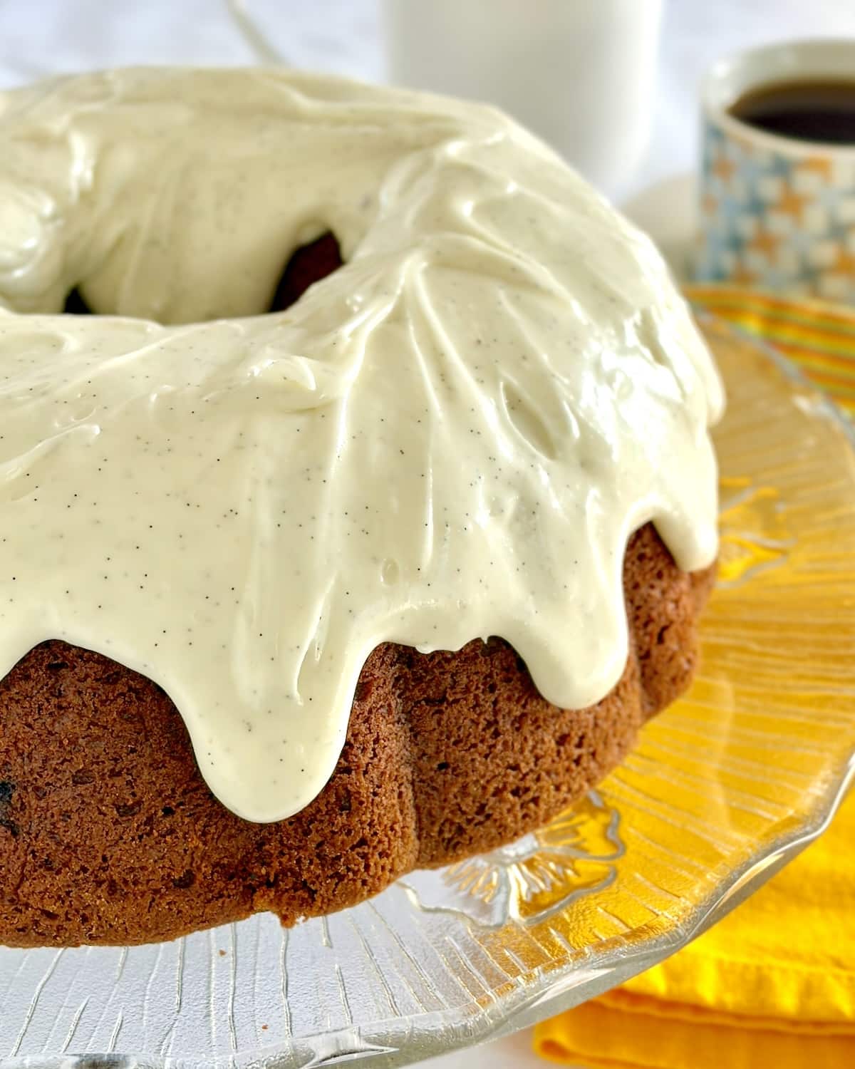 Close up photo of glazed Pumpkin Spice Walnut Cake.
