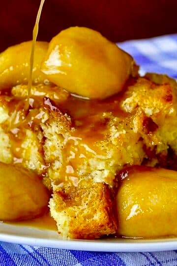 Maple Apple Bread Pudding close up photo of a single serving on a white plate