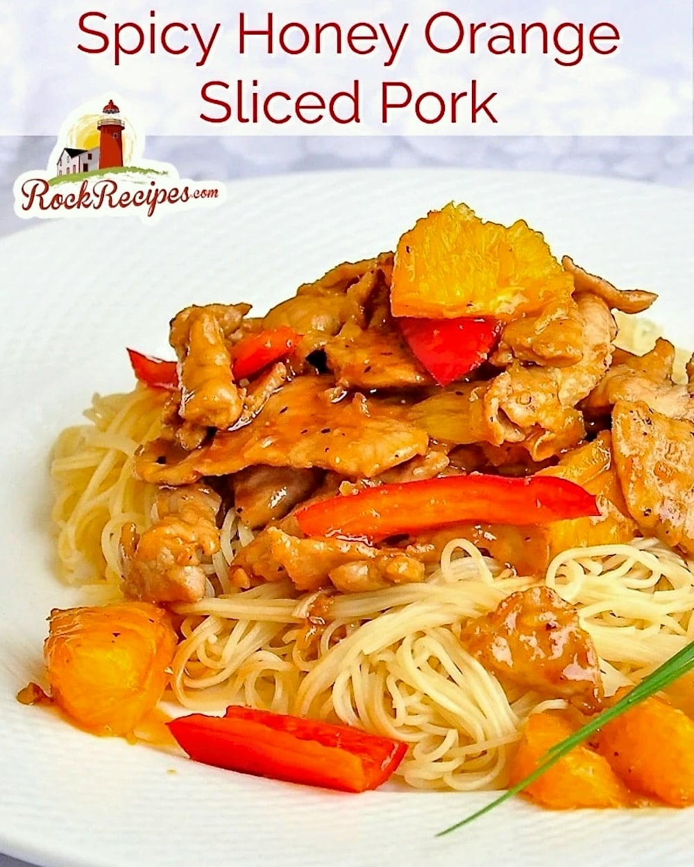 Spicy Honey Orange Sliced Pork with title text added for social media posts.